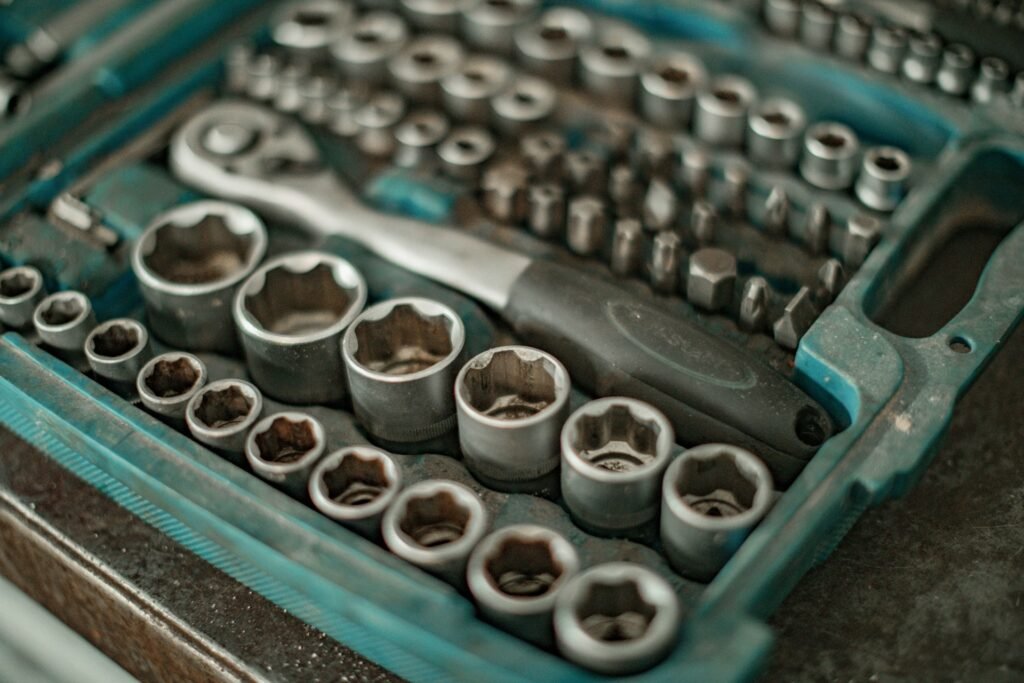 Socket set arranged in a teal tool case.