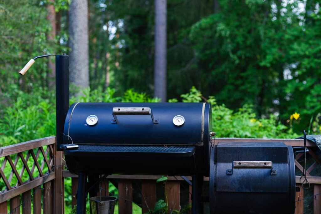 Barbecue smoker on a wooden backyard deck